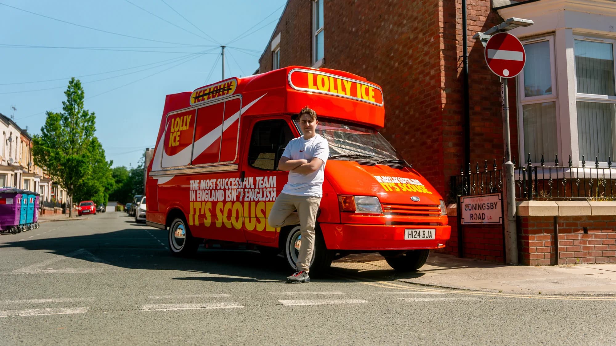 Joseph Roberts standing beside the red Nike Liverpool FC campaign van